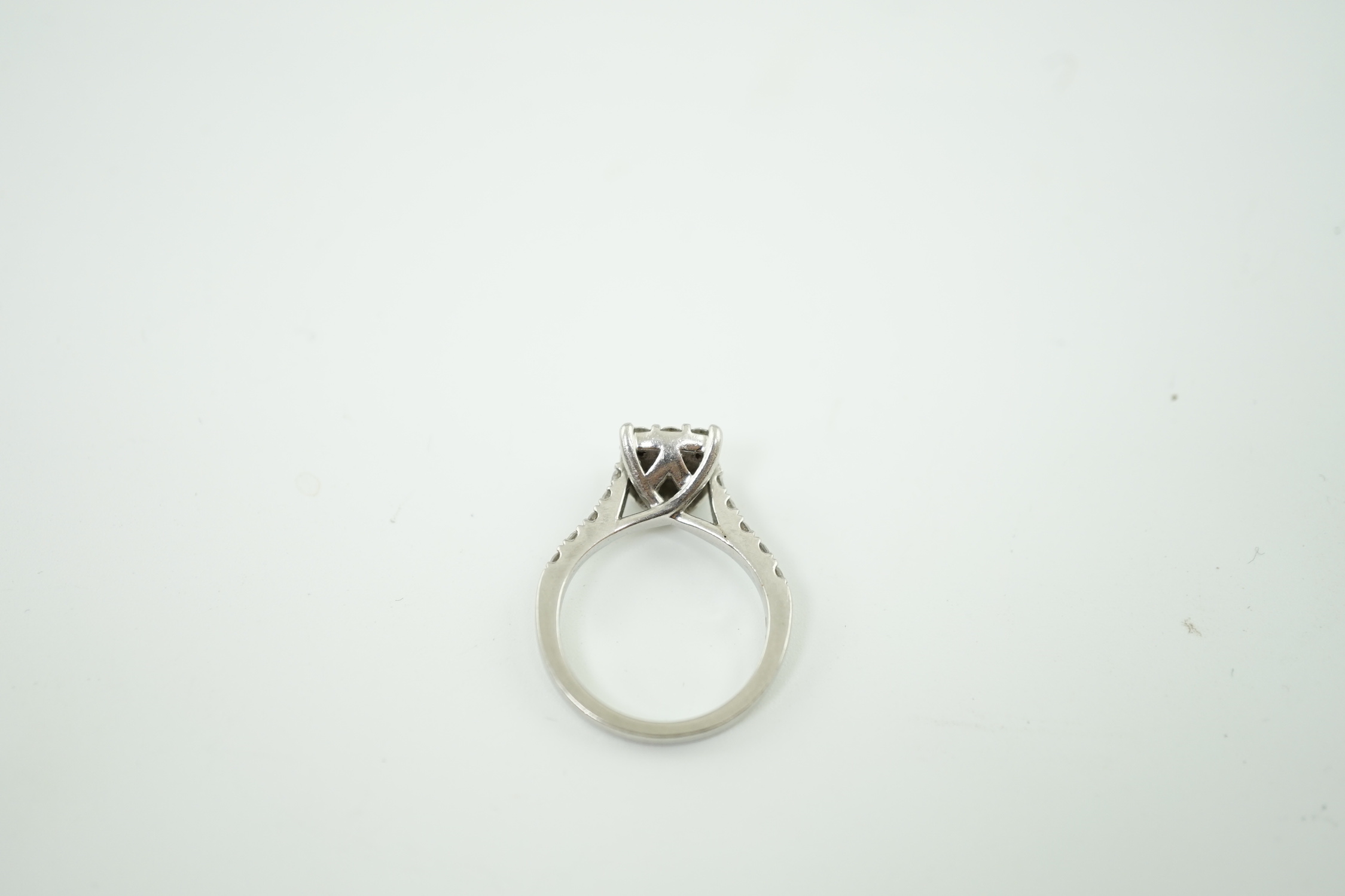 A modern platinum and nine stone diamond set square cluster ring